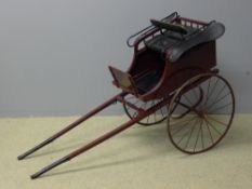 A Victorian dog cart With maroon and black painted decoration and metal spoked wheels. 155 cm long.