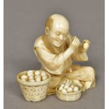 A late 19th/early 20th century Japanese carved ivory group Worked as an egg merchant,