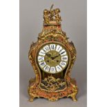 A boulle mantel clock The glazed front with pressed brass dial with Roman numerals and twin winding