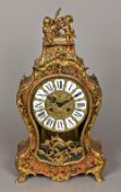 A boulle mantel clock The glazed front with pressed brass dial with Roman numerals and twin winding