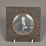 An 18th century portrait miniature of a gentleman wearing a blue coat at his desk Probably on ivory,