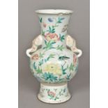 A 19th century Chinese famille rose porcelain vase Decorated in the round with a bird and an insect