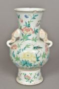 A 19th century Chinese famille rose porcelain vase Decorated in the round with a bird and an insect