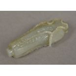 A Chinese carved white and russet jade cabbage pendant 9 cm long.