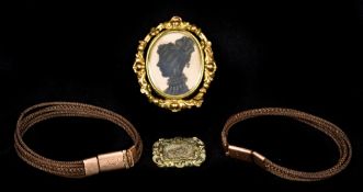 A small quantity of Victorian mourning jewellery Including: two hair plait bracelets,