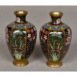 A pair of small cloisonne vases Each of hexagonal baluster form, decorated with floral vignettes.