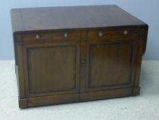 An early 19th century mahogany library reading table The hinged twin flap rounded rectangular top