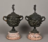 A pair of patinated bronze lidded urns Each of twin handled form with classical relief decorations,