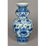 A Chinese blue and white porcelain baluster vase Decorated in the round with an aquatic scene. 27.