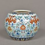 A Chinese Doucai porcelain vase Of squat form, decorated with stylised bats amongst lotus strapwork,
