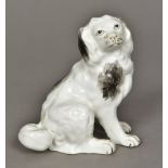 A 19th century porcelain model of a spaniel Naturally modelled seated. 10.5 cm high.