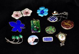 A quantity of enamel jewellery Comprising: brooches, pendants and earrings. Various sizes.