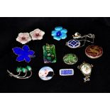 A quantity of enamel jewellery Comprising: brooches, pendants and earrings. Various sizes.