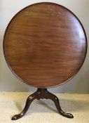 A George III mahogany tilt-top tripod table The dished top above the birdcage movement,