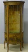 A Vernis Martin style serpentine vitrine The pressed brass three-quarter galleried marble top above