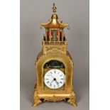 A Chinese gilt metal cased automaton table clock The 6 inch white painted dial with Roman numerals