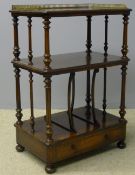A Victorian rosewood whatnot With three-quarter galleried top and turned uprights.