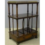 A Victorian rosewood whatnot With three-quarter galleried top and turned uprights.