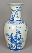 A Chinese blue and white porcelain baluster vase Decorated with exotic birds amongst floral sprays.