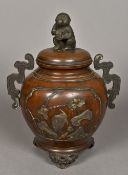 A Japanese mixed metal bronze twin handled koro and cover Worked with birds amongst foliate sprays,