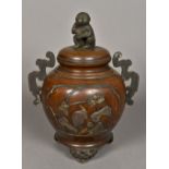 A Japanese mixed metal bronze twin handled koro and cover Worked with birds amongst foliate sprays,