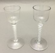 Two Georgian cordial glasses Each with bucket bowl and opaque twist stem. 14.5 cm high.