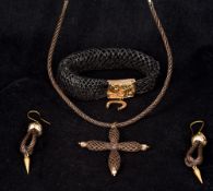 Four pieces of Victorian unmarked yellow metal mounted hair plait mourning jewellery Comprising: a