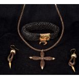 Four pieces of Victorian unmarked yellow metal mounted hair plait mourning jewellery Comprising: a