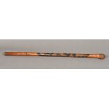 A late 19th century Japanese bamboo walking stick Carved to one side with skeletons and various