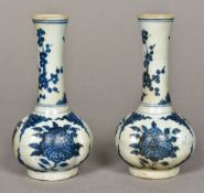 A pair of Chinese blue and white porcelain vases Of lobed form, decorated with floral sprays.