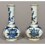 A pair of Chinese blue and white porcelain vases Of lobed form, decorated with floral sprays.