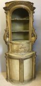 An 18th century and later Continental painted carved pine tabernacle cabinet The acanthus carved