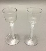 Two Georgian cordial glasses Each with bucket bowl and opaque twist stem. 14.5 and 15.5 cm high.