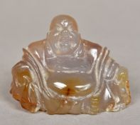 A Chinese carved agate Buddha Modelled seated. 6 cm high.