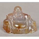 A Chinese carved agate Buddha Modelled seated. 6 cm high.