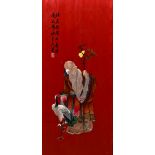 A Chinese embroidered silk picture Depicting Shou Lao holding a staff with a crane at his feet,