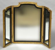A 19th century carved giltwood framed triptych dressing table mirror Of twin hinged section form,