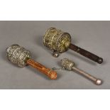 Three Tibetan unmarked white metal mounted prayer wheels Each of typical form, two cabochon mounted.