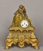 A 19th century ormolu cased figural mantel clock The white enamelled dial with Roman numerals,