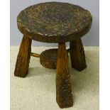 A carved oak stool by Peter Heap of Wetwang (Rabbitman) The circular florally carved top above the
