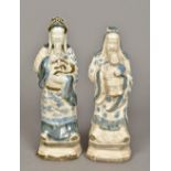 A pair of Chinese pottery figures One worked as a sage stroking his beard,