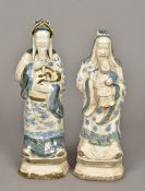 A pair of Chinese pottery figures One worked as a sage stroking his beard,