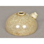 A Chinese porcelain water dropper Of domed form with allover crackle glaze. 4 cm high.