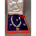 A suite of Indian jewellery Comprising: a two-strand necklace with a pendant,