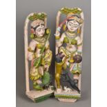 A pair of Hindu painted wooden temple carvings One formed as a musician,