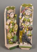 A pair of Hindu painted wooden temple carvings One formed as a musician,