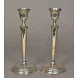 A pair of George V silver candlesticks, hallmarked Birmingham 1911,