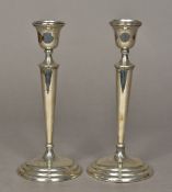 A pair of George V silver candlesticks, hallmarked Birmingham 1911,