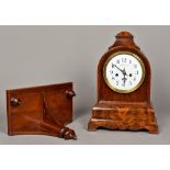 A 19th century mahogany cased bracket clock The arched domed case enclosing the white enamelled