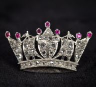 An unmarked platinum, ruby and diamond brooch Formed as a ducal coronet. 2.75 cm wide.